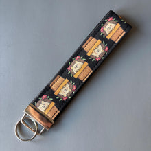 Load image into Gallery viewer, Hedgehog in plant pot wristlet keychain. Hedgehog keyring. Hedgehog wrist strap keyring.