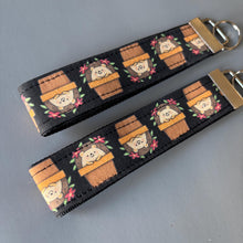 Load image into Gallery viewer, Hedgehog in plant pot wristlet keychain. Hedgehog keyring. Hedgehog wrist strap keyring.